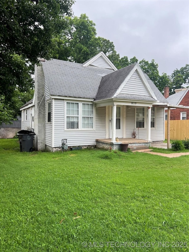 839 N New Haven Ave, Tulsa, OK 74115 - view of front of house with a porch and roof with shingles