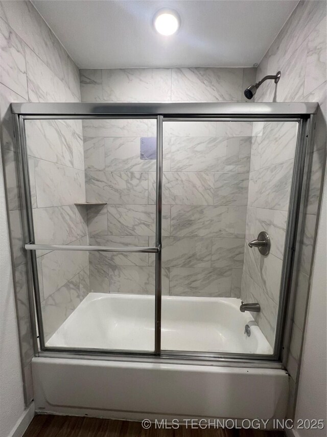 839 N New Haven Ave, Tulsa, OK 74115 - bathroom with shower / bath combination with glass door and wood finished floors