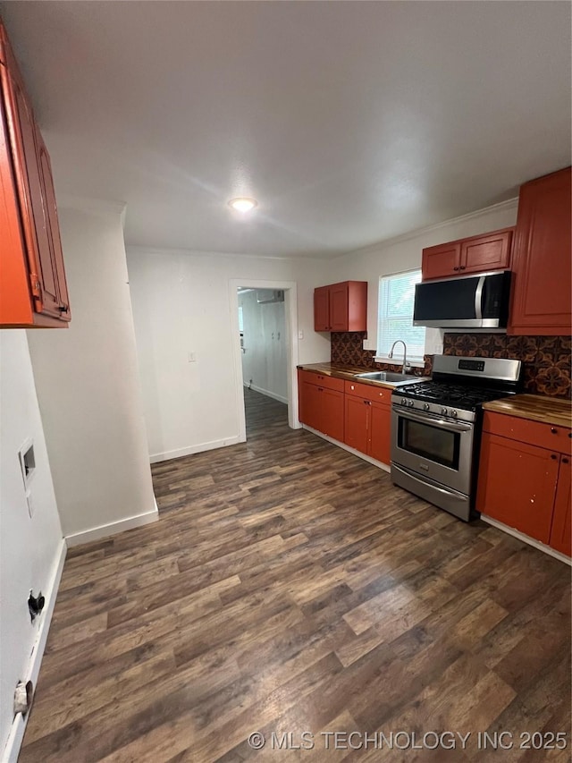839 N New Haven Ave, Tulsa, OK 74115 - kitchen with gas range, backsplash, dark wood-style flooring, dark countertops, and recessed lighting