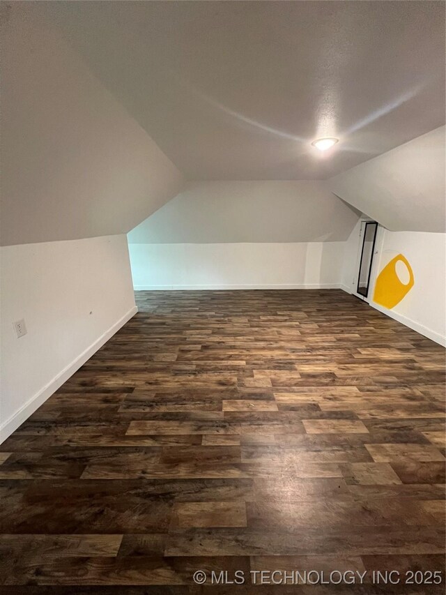 839 N New Haven Ave, Tulsa, OK 74115 - bonus room with dark wood-style floors and vaulted ceiling