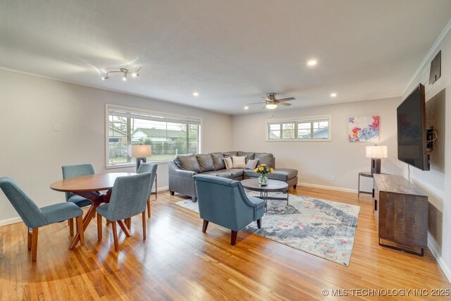 2441 S Norwood Ave, Tulsa, OK 74114 - living area featuring healthy amount of natural light, light wood-type flooring, ceiling fan, and recessed lighting
