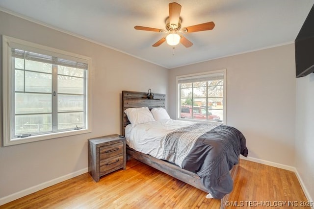2441 S Norwood Ave, Tulsa, OK 74114 - bedroom with crown molding, light wood-style flooring, and a ceiling fan