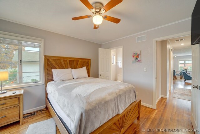 2441 S Norwood Ave, Tulsa, OK 74114 - bedroom featuring light wood-type flooring, ornamental molding, and a ceiling fan