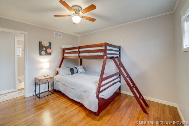 2441 S Norwood Ave, Tulsa, OK 74114 - bedroom featuring wood finished floors, crown molding, and a ceiling fan