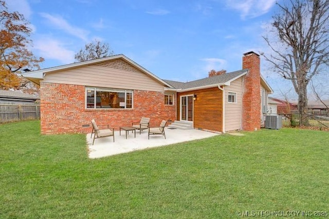 2441 S Norwood Ave, Tulsa, OK 74114 - rear view of house with entry steps, a chimney, a patio area, and brick siding