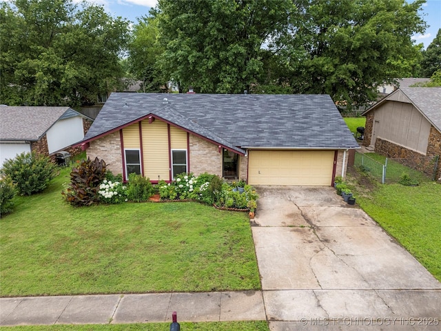 4504 S Cedar Ave, Broken Arrow, OK 74011 - view of front of property featuring a garage, driveway, brick siding, and roof with shingles
