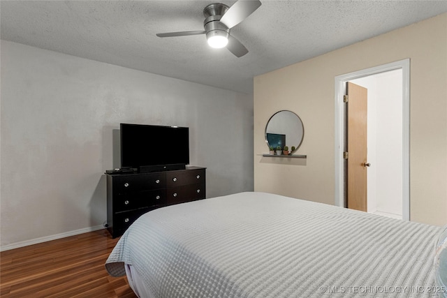 4504 S Cedar Ave, Broken Arrow, OK 74011 - bedroom featuring wood finished floors, a textured ceiling, and ceiling fan