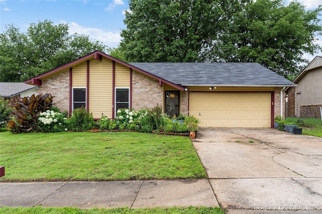 4504 S Cedar Ave, Broken Arrow, OK 74011 - mid-century inspired home with brick siding, an attached garage, and a front lawn