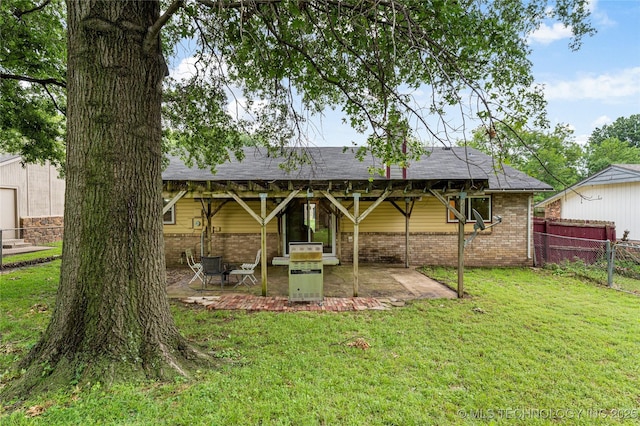 4504 S Cedar Ave, Broken Arrow, OK 74011 - back of house with brick siding and a patio area