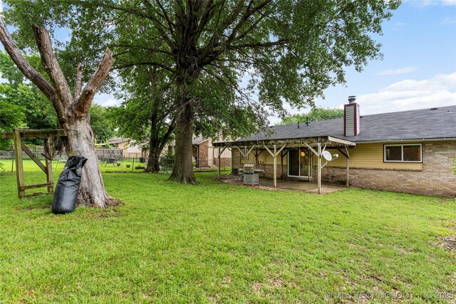 4504 S Cedar Ave, Broken Arrow, OK 74011 - view of yard featuring a patio