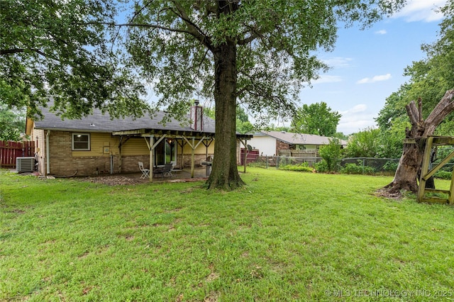 4504 S Cedar Ave, Broken Arrow, OK 74011 - fenced backyard with a patio area
