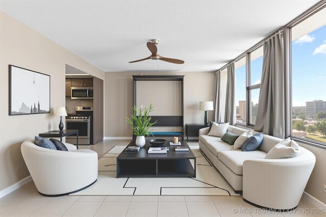 410 W 7th St Unit 1530, Tulsa, OK 74119 - living area featuring baseboards and a ceiling fan