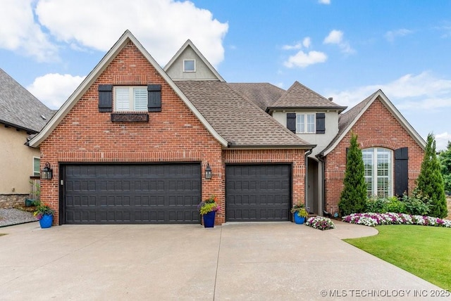 9402 E 109th St S, Tulsa, OK 74133 - traditional-style home featuring driveway, brick siding, a shingled roof, and stucco siding