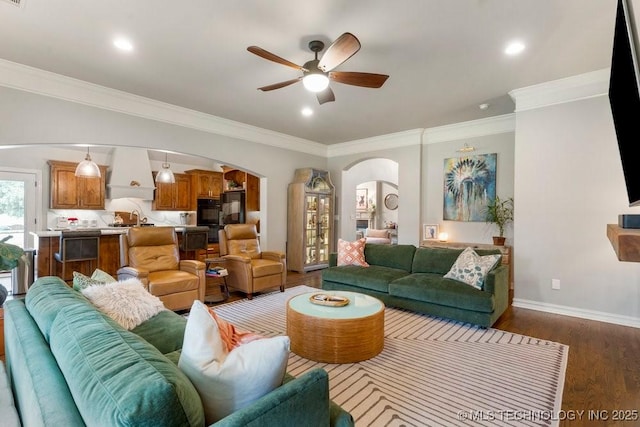 9402 E 109th St S, Tulsa, OK 74133 - living area with arched walkways, ceiling fan, ornamental molding, dark wood finished floors, and recessed lighting
