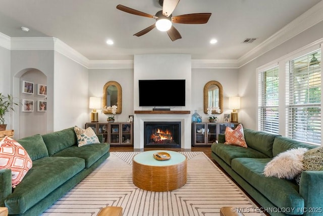 9402 E 109th St S, Tulsa, OK 74133 - living area featuring ceiling fan, wood finished floors, a fireplace with flush hearth, recessed lighting, and ornamental molding