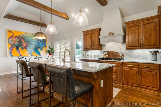 9402 E 109th St S, Tulsa, OK 74133 - kitchen featuring premium range hood, light countertops, a kitchen bar, and dark wood-style flooring