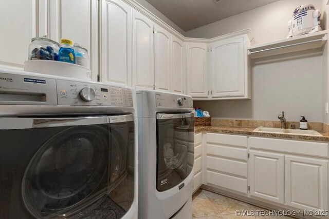 9402 E 109th St S, Tulsa, OK 74133 - laundry room with separate washer and dryer, cabinet space, and light tile patterned flooring