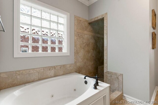 9402 E 109th St S, Tulsa, OK 74133 - bathroom featuring a tub with jets, healthy amount of natural light, and crown molding