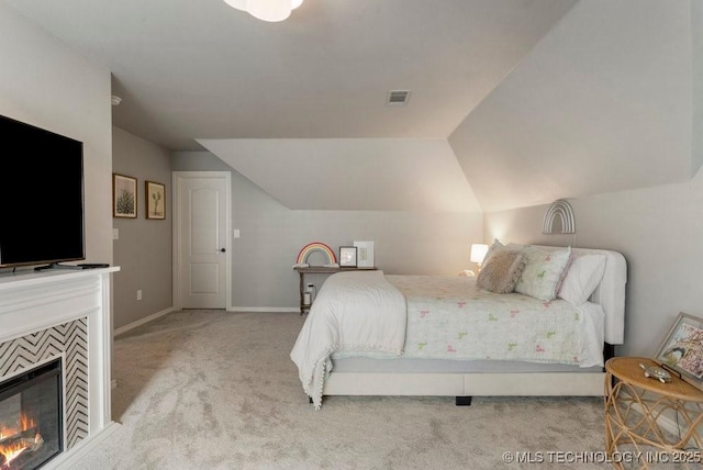 9402 E 109th St S, Tulsa, OK 74133 - carpeted bedroom featuring lofted ceiling and a fireplace