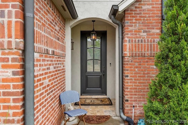 9402 E 109th St S, Tulsa, OK 74133 - doorway to property with brick siding