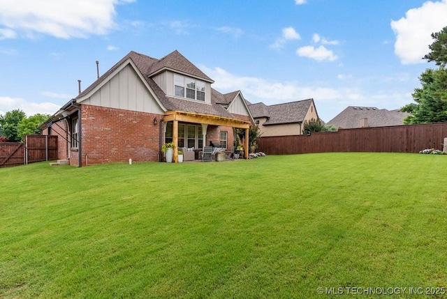 9402 E 109th St S, Tulsa, OK 74133 - rear view of property with brick siding, a fenced backyard, board and batten siding, and a patio