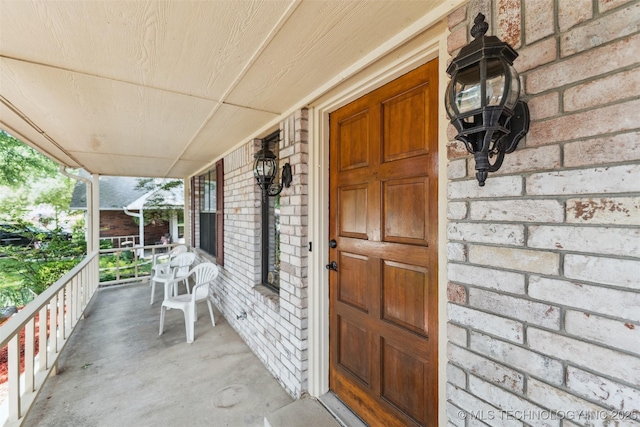 312 W Raleigh Pl, Broken Arrow, OK 74011 - doorway to property with covered porch and brick siding