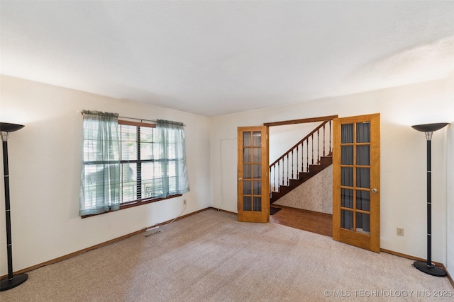 312 W Raleigh Pl, Broken Arrow, OK 74011 - carpeted spare room featuring stairs and french doors
