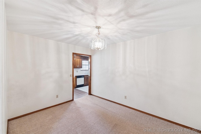 312 W Raleigh Pl, Broken Arrow, OK 74011 - empty room with light colored carpet and a chandelier
