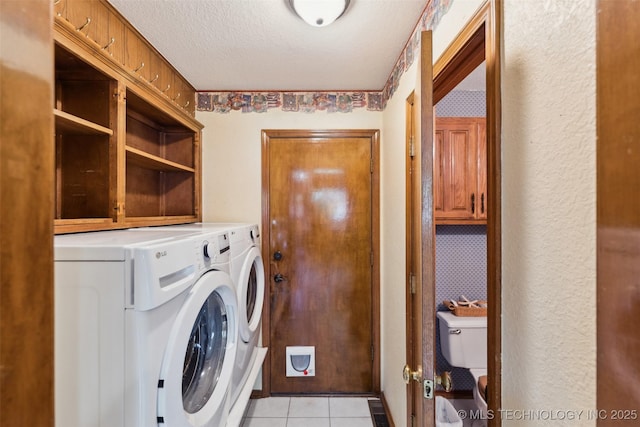312 W Raleigh Pl, Broken Arrow, OK 74011 - laundry room with washing machine and dryer, light tile patterned floors, and a textured ceiling