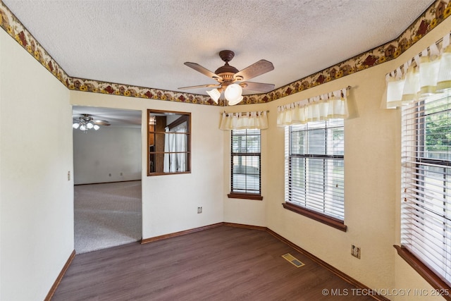 312 W Raleigh Pl, Broken Arrow, OK 74011 - unfurnished room featuring a ceiling fan, a textured ceiling, and wood finished floors