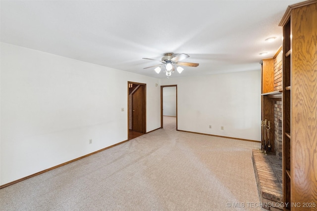 312 W Raleigh Pl, Broken Arrow, OK 74011 - unfurnished living room featuring a brick fireplace, a ceiling fan, and carpet flooring