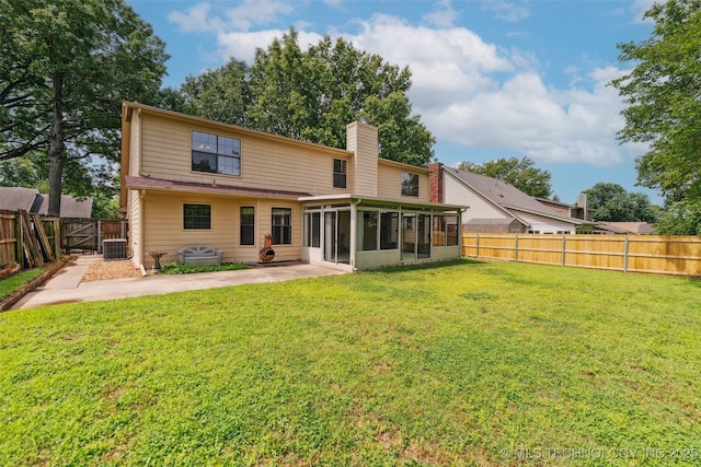 312 W Raleigh Pl, Broken Arrow, OK 74011 - rear view of house with a sunroom, a fenced backyard, a chimney, and a patio area