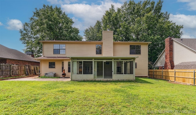 312 W Raleigh Pl, Broken Arrow, OK 74011 - back of house with a sunroom, a chimney, and a fenced backyard