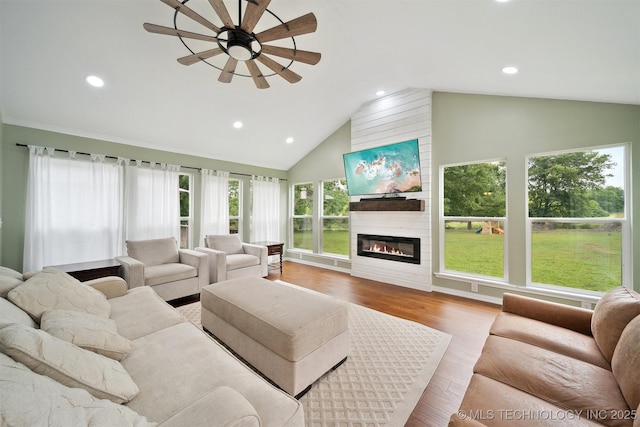 9065 E Prairie View Dr, Claremore, OK 74019 - living area featuring a ceiling fan, recessed lighting, a large fireplace, wood finished floors, and high vaulted ceiling