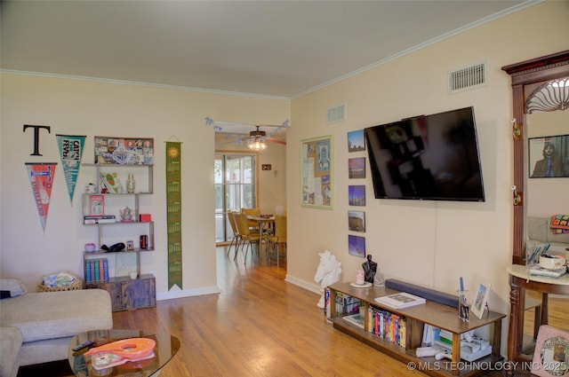 2513 S Sandusky Ave, Tulsa, OK 74114 - living area featuring wood finished floors, a ceiling fan, and ornamental molding
