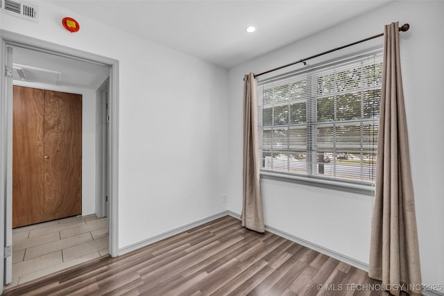 4517 S Peoria Ave Unit 31A, Tulsa, OK 74105 - empty room with wood finished floors and recessed lighting