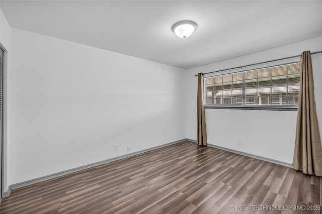 4517 S Peoria Ave Unit 31A, Tulsa, OK 74105 - empty room with wood finished floors and baseboards