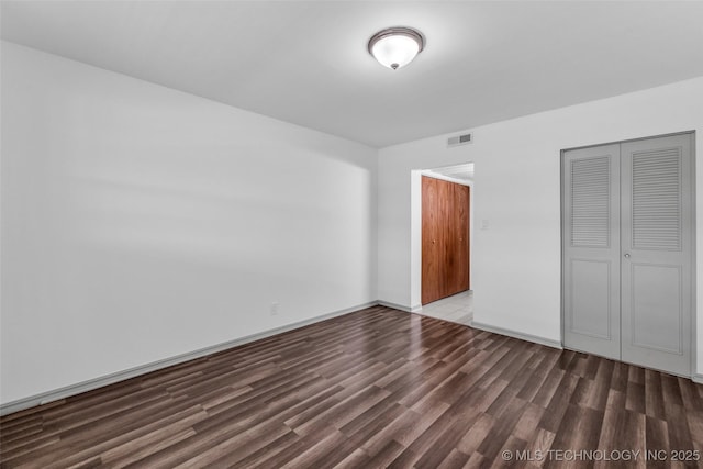 4517 S Peoria Ave Unit 31A, Tulsa, OK 74105 - unfurnished bedroom with a closet and wood finished floors