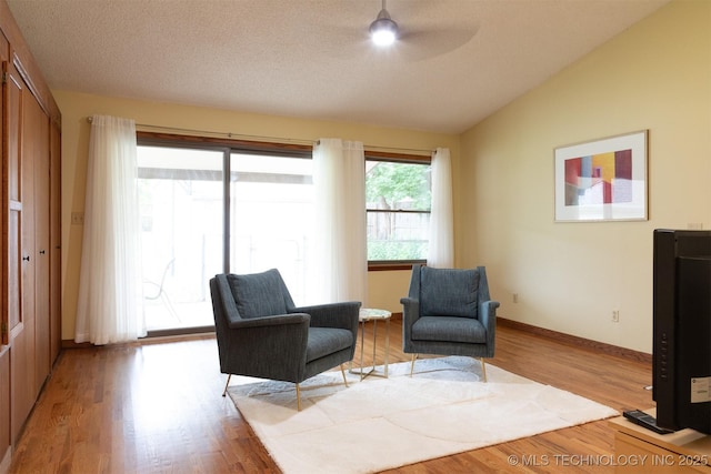 3524 E 12th Pl, Tulsa, OK 74112 - living area featuring ceiling fan, vaulted ceiling, and light wood-style flooring