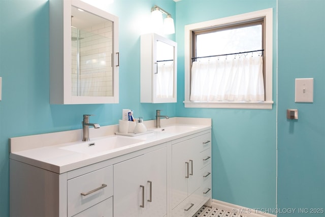 3524 E 12th Pl, Tulsa, OK 74112 - bathroom with double vanity and baseboards