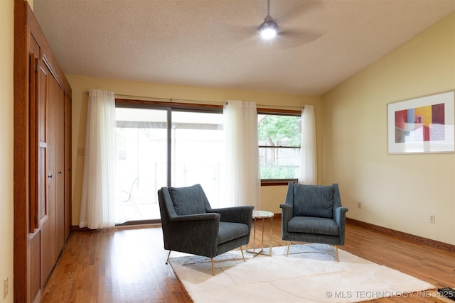 3524 E 12th Pl, Tulsa, OK 74112 - living area with light wood finished floors, a ceiling fan, and vaulted ceiling