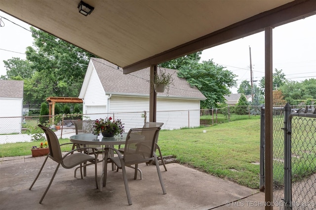 3524 E 12th Pl, Tulsa, OK 74112 - fenced backyard featuring a patio area and outdoor dining area