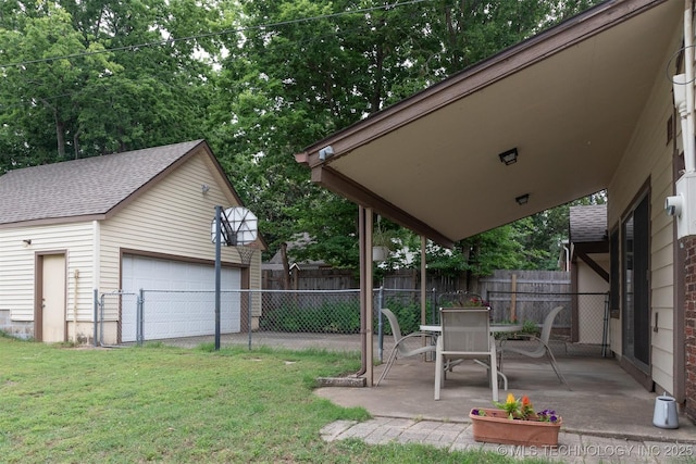 3524 E 12th Pl, Tulsa, OK 74112 - view of yard with an outdoor structure, a detached garage, and a patio