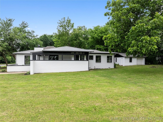 575 N 7th St, Muskogee, OK 74401 - rear view of property with a yard and a metal roof