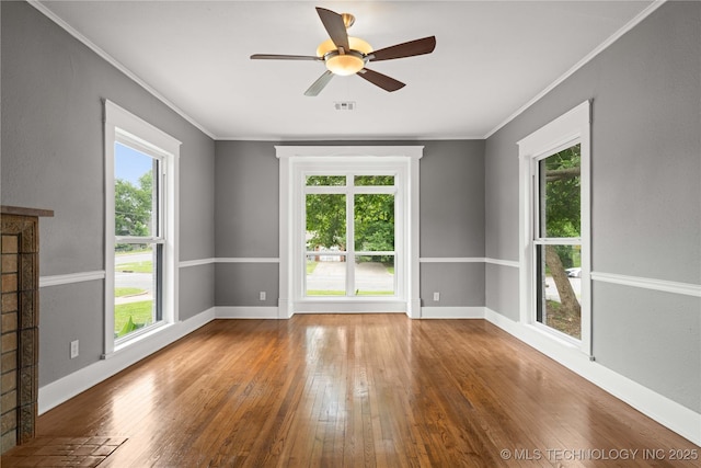 575 N 7th St, Muskogee, OK 74401 - spare room featuring hardwood / wood-style floors, healthy amount of natural light, ornamental molding, and ceiling fan