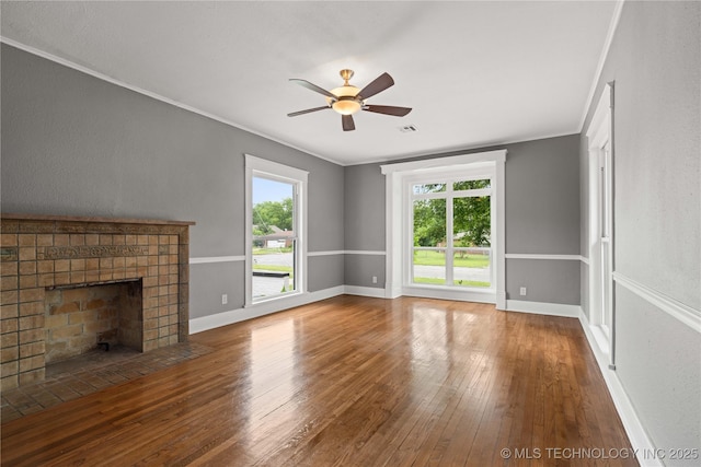 575 N 7th St, Muskogee, OK 74401 - unfurnished living room with wood-type flooring, a ceiling fan, a brick fireplace, and ornamental molding