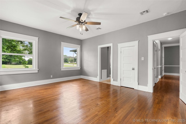 575 N 7th St, Muskogee, OK 74401 - unfurnished bedroom with wood finished floors and a ceiling fan