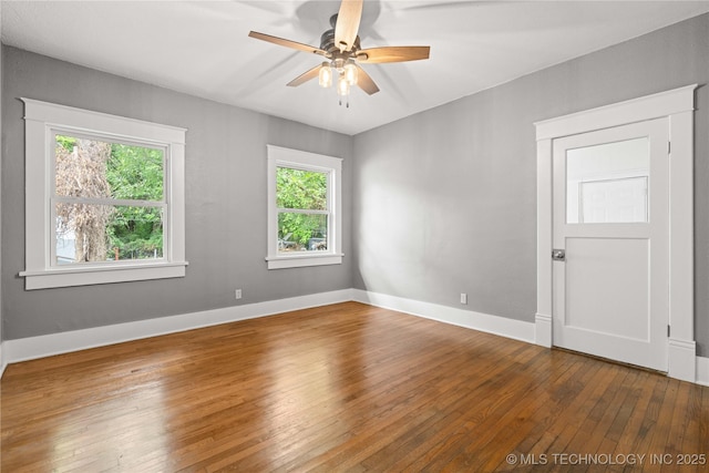 575 N 7th St, Muskogee, OK 74401 - empty room featuring hardwood / wood-style flooring, plenty of natural light, and ceiling fan