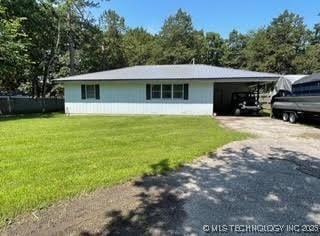 25961 S 621st Rd, Grove, OK 74344 - view of front of home featuring driveway, a front yard, and an attached carport