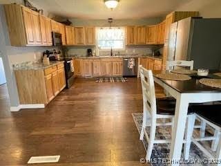 25961 S 621st Rd, Grove, OK 74344 - kitchen with stainless steel appliances, dark wood-style floors, and light brown cabinets